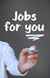 Businessman writing jobs for you with a marker