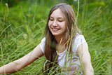 portrait of beautiful teen girl on the grass