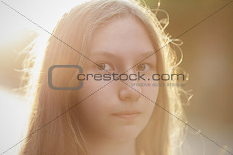close up portrait of attractive teen girl in sunset