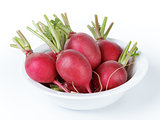 heap of ripe radishes in plate