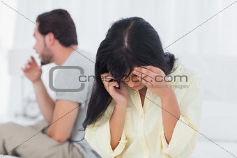 Woman calling and crying during dispute