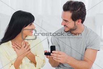 Man proposing to his surprised girlfriend