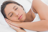 Calm woman sleeping in bed