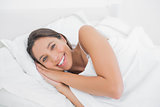 Beautiful woman resting in bed