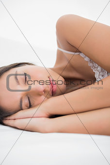 Portrait of a woman lying in bed