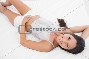 Attractive woman lying in bed