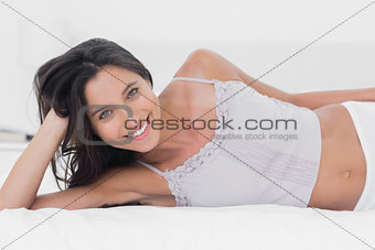 Attractive woman relaxing in bed