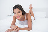 Woman relaxing lying in bed