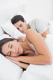 Beautiful woman sleeping next to her partner
