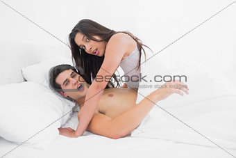 Young couple caught in the act in bed