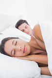 Beautiful woman sleeping next to her partner