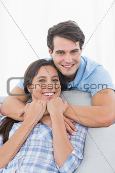 Portrait of a man embracing his partner