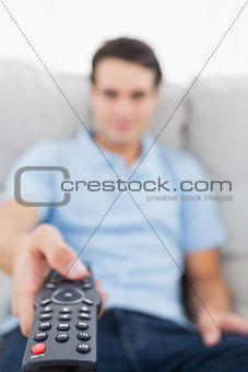 Portrait of a man changing channel
