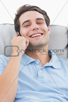 Man laughing while being on the phone