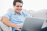 Attractive man using his laptop