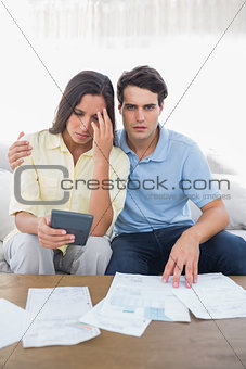 Stressed couple doing their accounts
