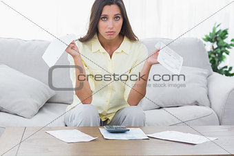 Concerned woman doing her accounts