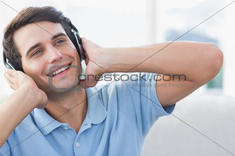 Cheerful man enjoying music
