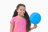 Little girl holding blue balloon