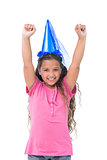 Little girl with blue hat holding up her arms