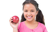 Little girl holding apple in her hand