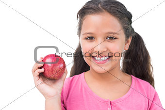 Little girl holding apple in her hand