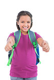 Little girl with book bag does thumbs up at camera