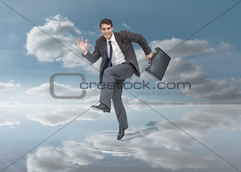 Businessman walking on a puddle