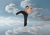 Martial arts fighter over puddle