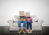 Funny couple wearing boxes on their head