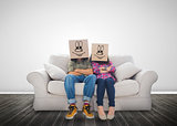 Couple wearing funny boxes on their head