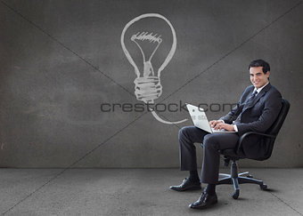 Businessman using his laptop with arrow graphic coming from it