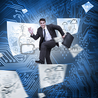 Businessman jumping with drawings floating around