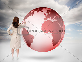 Businesswoman drawing on a red planet