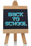 Back to school written in blue on chalkboard
