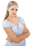 Furious blonde woman with crossed arms