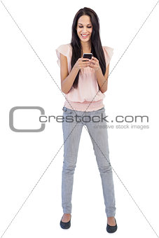 Young woman receiving text message