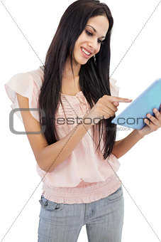 Cheerful brunette using tablet pc
