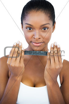 Happy woman holding nail file