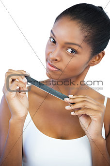 Brunette holding her nail file