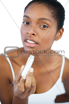Woman holding her lip balm