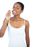 Smiling woman smelling her lip balm