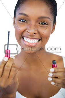 Smiling woman showing her mascara