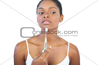 Woman holding her toothbrush