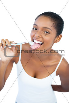 Funny woman brushing her tongue with toothbrush