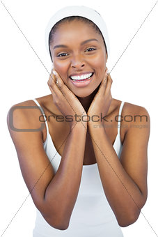 Cheerful woman with headband crossing her arms