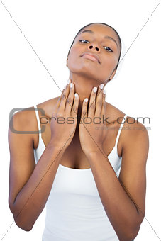 Woman touching her neck