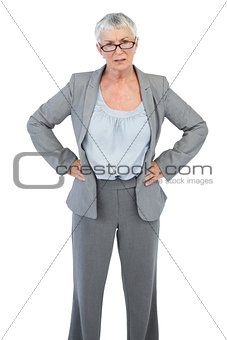 Serious businesswoman with her hands on hips