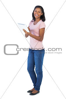 Smiling woman using tablet pc