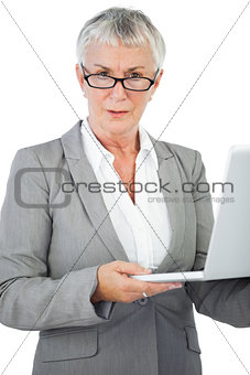 Businesswoman with glasses holding her laptop